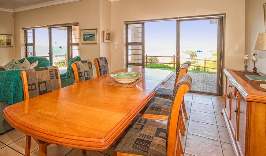 The downstairs living area is open plan and includes a spacious TV room and dining room that opens up to a covered patio. The downstairs living area is open plan and includes a spacious TV room and dining room that opens up to a covered patio.