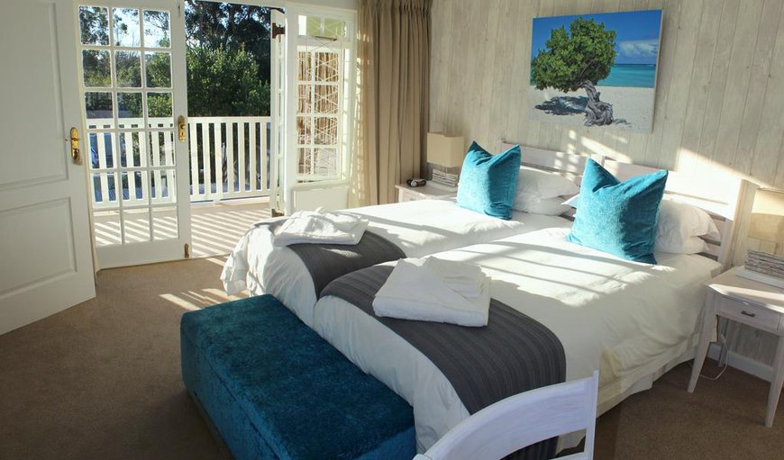 Room 2 Divi Divi: The Divi Divi Room has 2 single beds which converts to a King-sized bed and has an en-suite bathroom