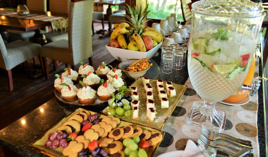 Enjoy an extensive buffet breakfast or order a delicious hot plated breakfast to indulge in after your morning safari either in our gorgeous dining room which boasts an impressive hundred year old Jackalberry rising through the deck of the dining room and thatched roof or under the tree’s on the outside decks. Enjoy an extensive buffet breakfast or order a delicious hot plated breakfast to indulge in after your morning safari either in our gorgeous dining room which boasts an impressive hundred year old Jackalberry rising through the deck of the dining room and thatched roof or under the tree’s on the outside decks.