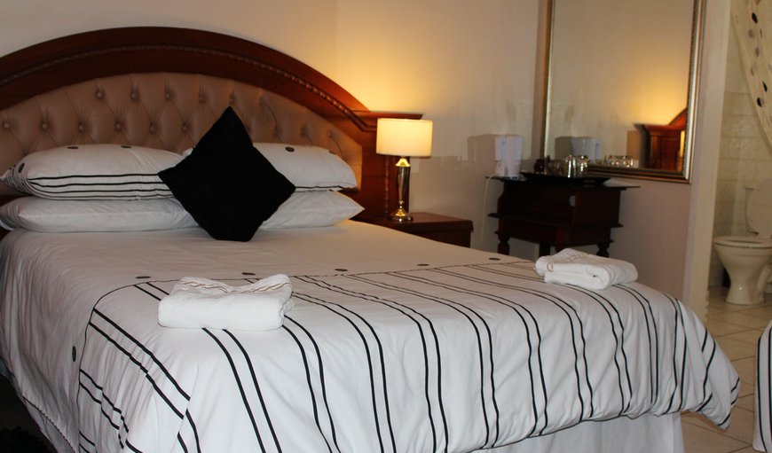 Room 9: Room 9 - This room has a queen size bed and two single beds.