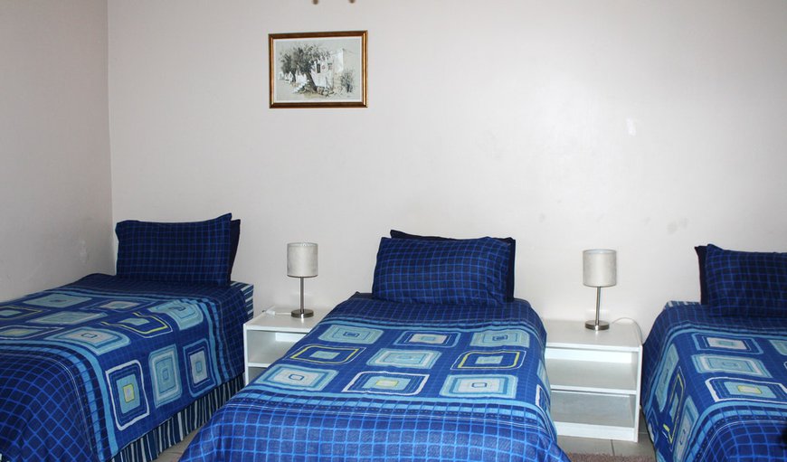 Room 4: Room 4 - This bedroom contains three single beds.