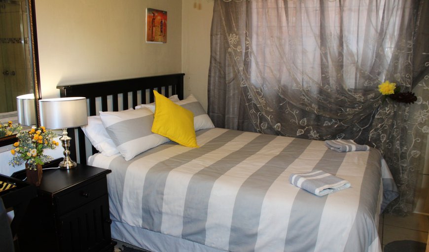Room 5: Room 5 - This bedroom contains a double bed sleeping two guests comfortably.