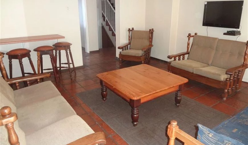 2 Bedroom - 4 Sleeper: 4 Sleeper unit- Lounge with comfortable seating & a TV with DSTV.