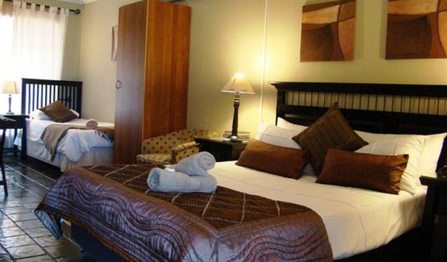 Family Rooms 3 Sleeper Full En-Suite: Family Rooms 3 Sleeper Full En-Suite - Bedroom with a double bed and a single bed
