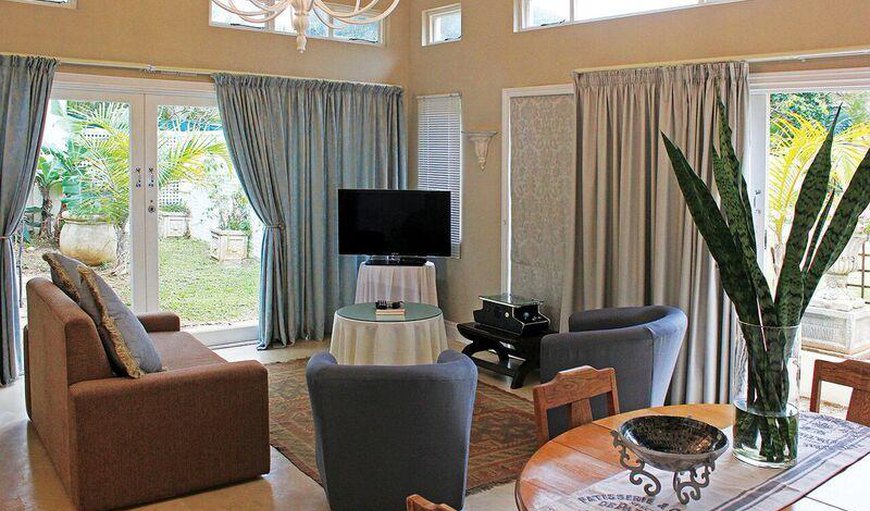 Cottage with Garden View: The cottage also has a lounge area with a flat screen TV