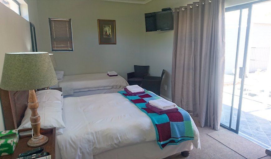 Room 6: Room 6 - This bedroom is furnished with a double bed and a single bed
