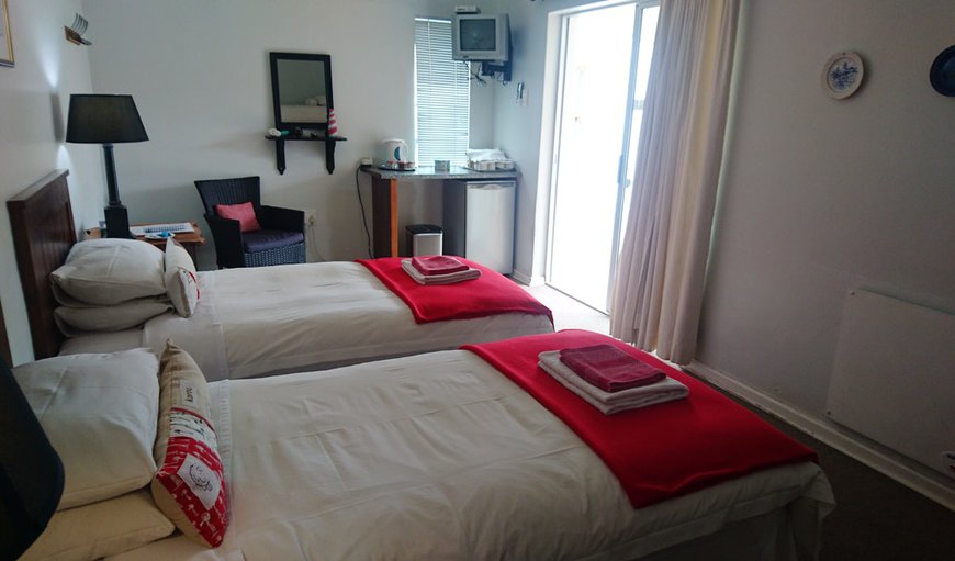 Room 2: Room 2 - This bedroom offers 2 single beds and a bunk bed