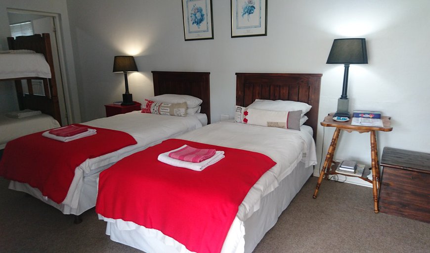 Room 2: Room 2 - This bedroom offers 2 single beds and a bunk bed