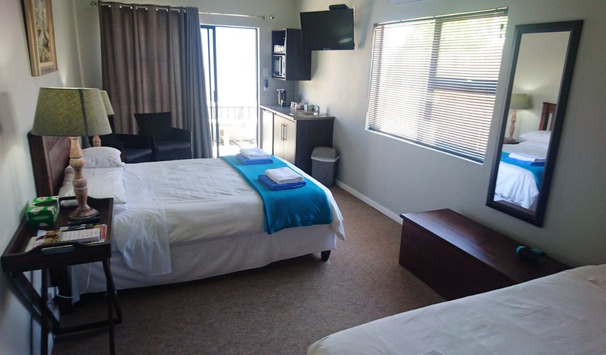 Room 5: Room 5 - This bedroom is furnished with a double bed and a single bed