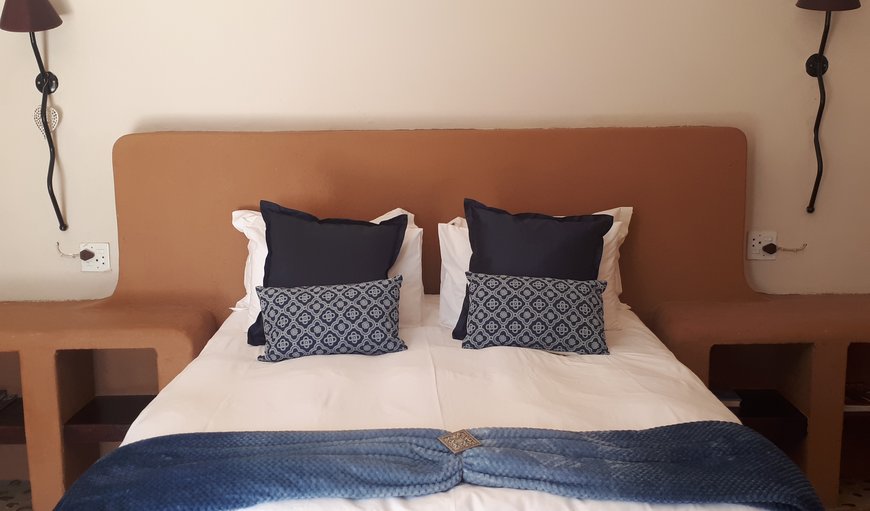 Room 1: Room 1 has a queen size bed and three single beds