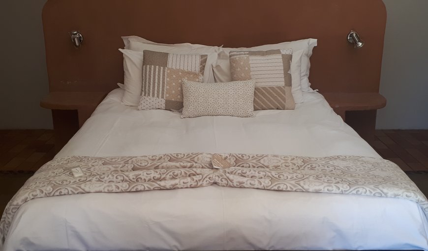 Room 2: Room 2 has a queen size bed and two single beds