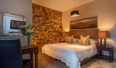Yellow Finch Palace: Contemporary Stone Bedroom