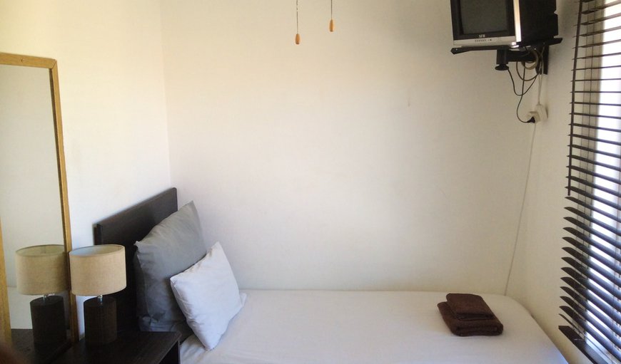 Single Room: Single Bed room with single bed and TV.
