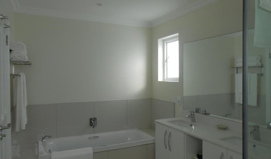 Fuchsia: The en-suite bathroom has a bath, shower and double basins