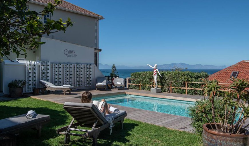 The guest house offers an outdoor swimming pool with loungers and a spectacular view.