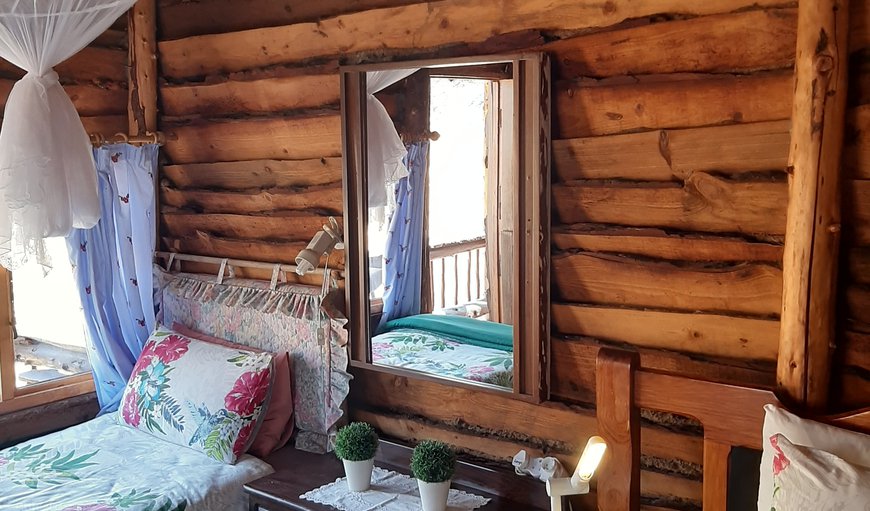 Single bed with mosquito net, mirror, little cupboard, and a lovely view onto the mountain where wildlife can often be spotted Single bed with mosquito net, mirror, little cupboard, and a lovely view onto the mountain where wildlife can often be spotted