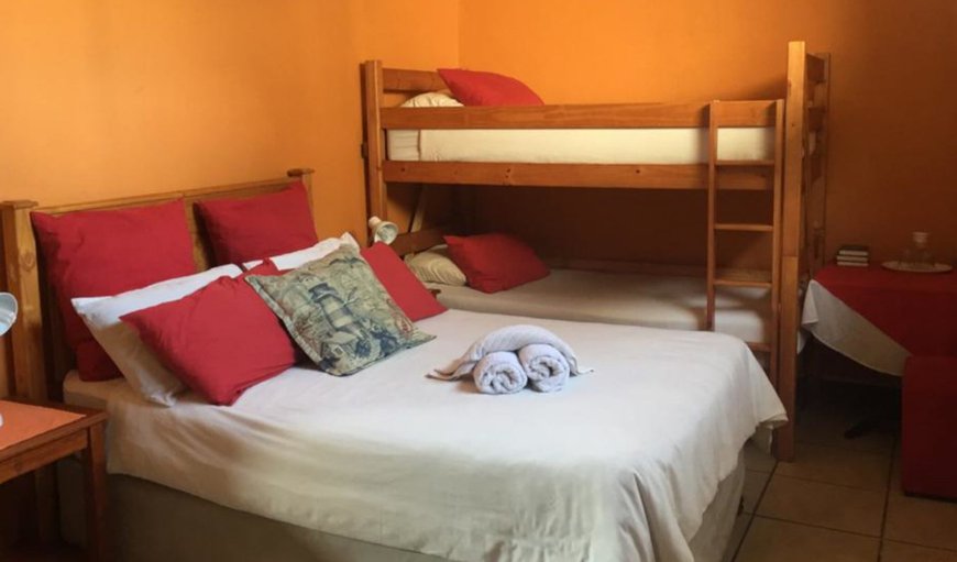 Three Bedroom Apartment- Sleeping 8 pax: Bedroom with a double bed and bunk bed