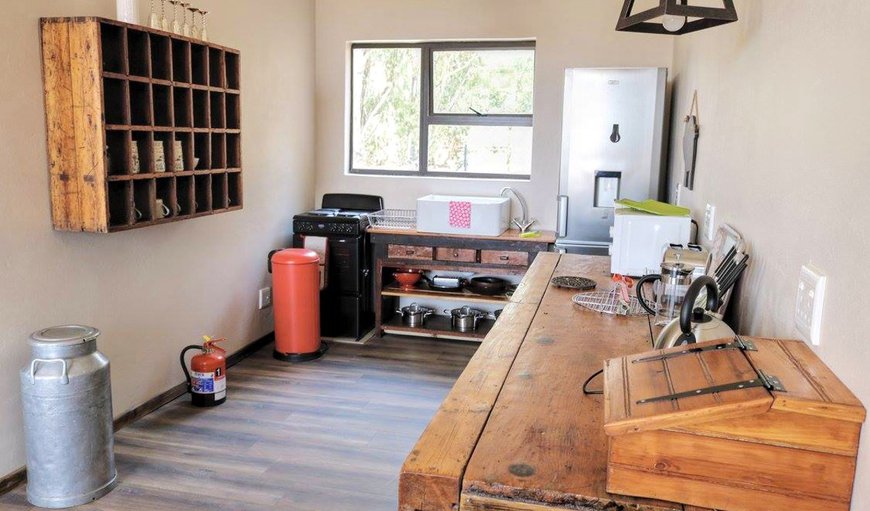 Top Deck Apartment - The open plan kitchen is equipped with a fridge, stove, microwave, toaster and kettle. Top Deck Apartment - The open plan kitchen is equipped with a fridge, stove, microwave, toaster and kettle.