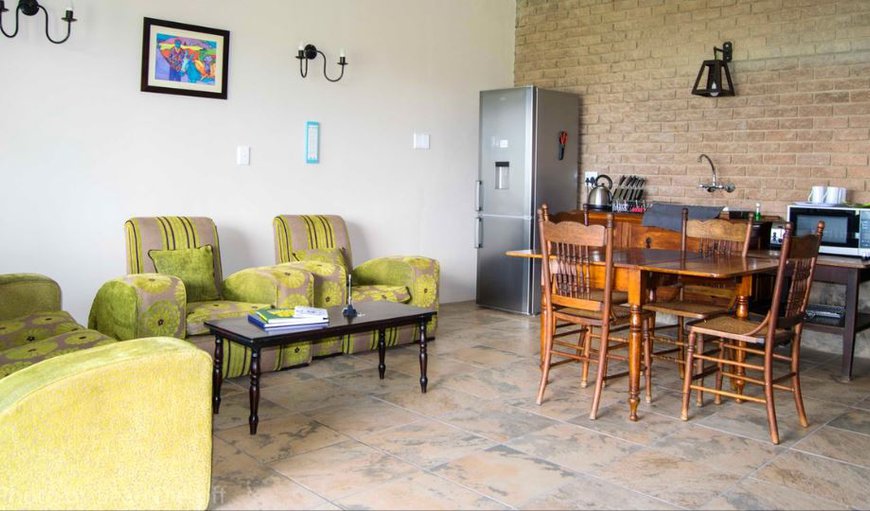 The Family Apartment: The Family Apartment - The dining area contains a dining table with four chairs.