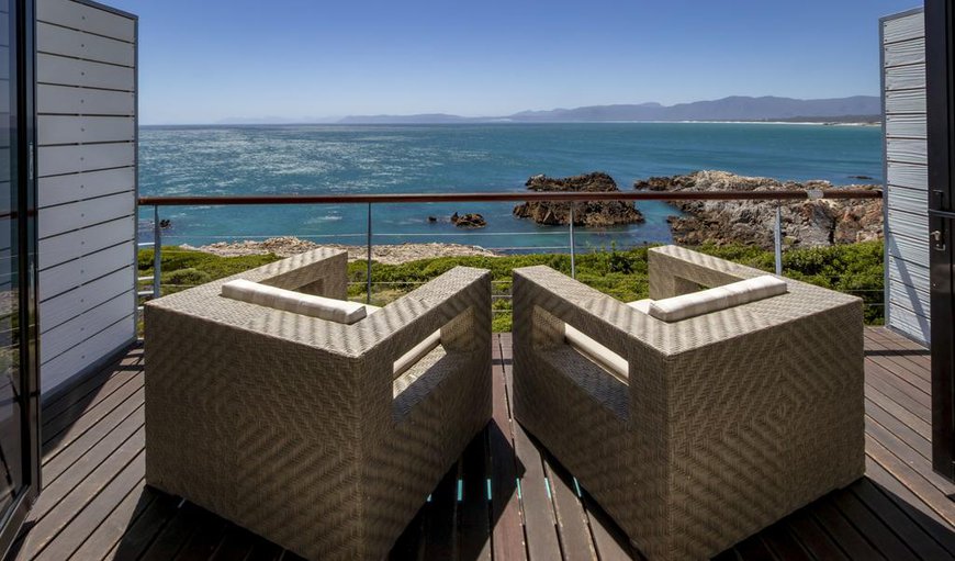 North room: North Room - Double doors open onto a sea-front deck where you can relax in a deck chair while you watch whales play just meters from the room.