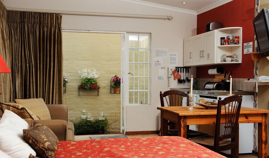 Studio Flatlet King/twin(Ochre) - Bedroom with a king size bed or twin beds and a double sleeper couch Studio Flatlet King/twin(Ochre) - Bedroom with a king size bed or twin beds and a double sleeper couch