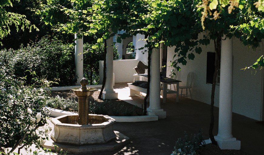 Family Cottage with a Pool View: The Fountain in the Courtyard