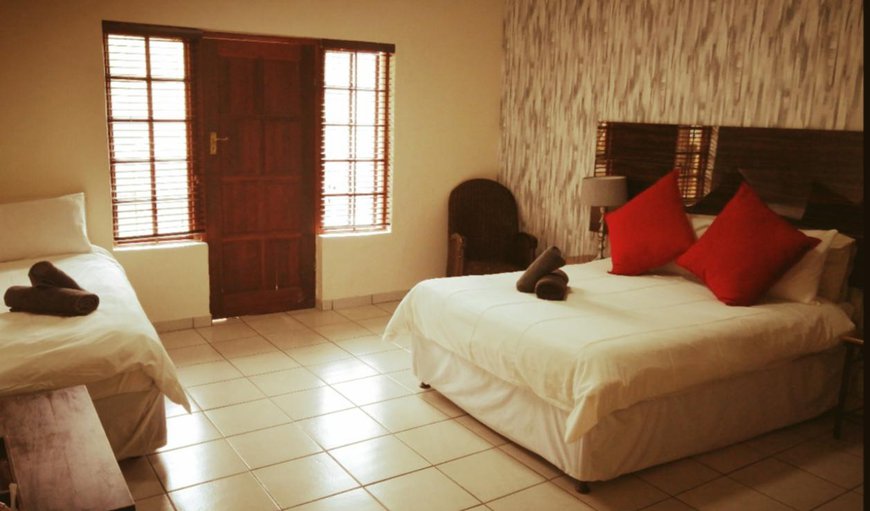 Double Rooms Bath Only: Triple Rooms Bath Only - Bedroom with a double bed and a single bed