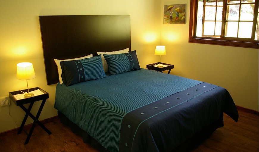 2-Bedroom, 4-Sleeper Chalets with a double bed.