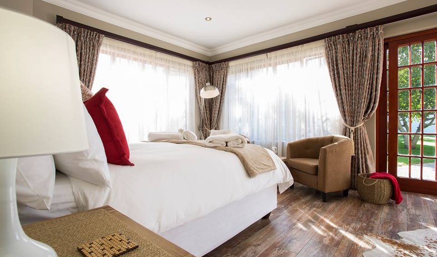 The Garden: The Garden Suite with a queen size bed and comfortable seating.