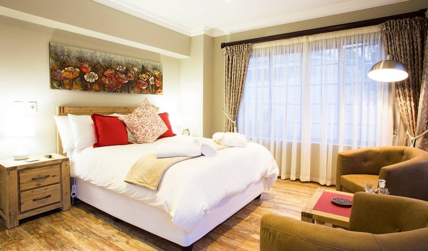 The Garden: The Garden Suite with a queen size bed and comfortable seating.