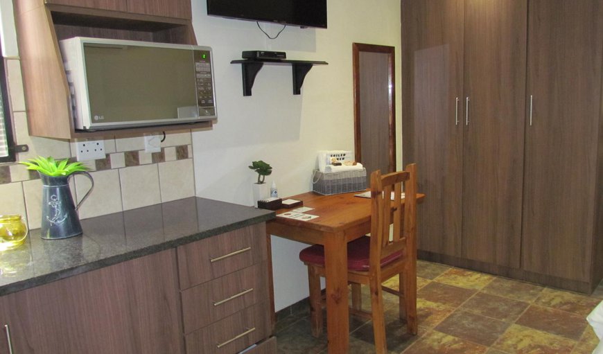 Self Catering Unit: Self Catering Unit - The kitchenette has a fridge and microwave