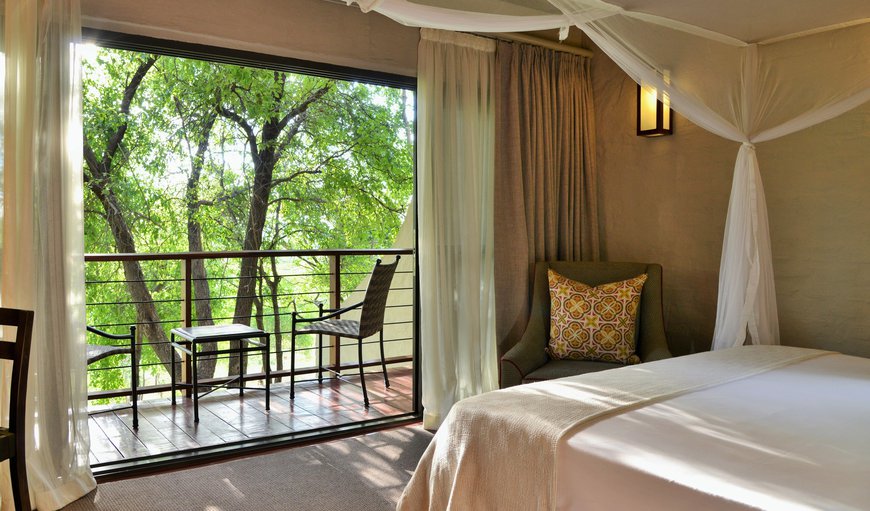 Three-Bedroom Suite: Each of the Safari Suites boast a Master Gallery Bedroom upstairs with glass sliding doors opening onto a private balcony that affords a superb vista over unspoilt bushveld
