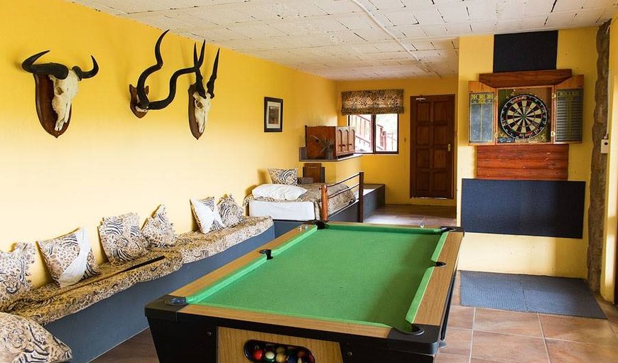 Mabalingwe Uzuri Lodge Games room with a pool table and dart board as well as a bush patio, dvd area and overflow room for singles or families. Mabalingwe Uzuri Lodge Games room with a pool table and dart board as well as a bush patio, dvd area and overflow room for singles or families.