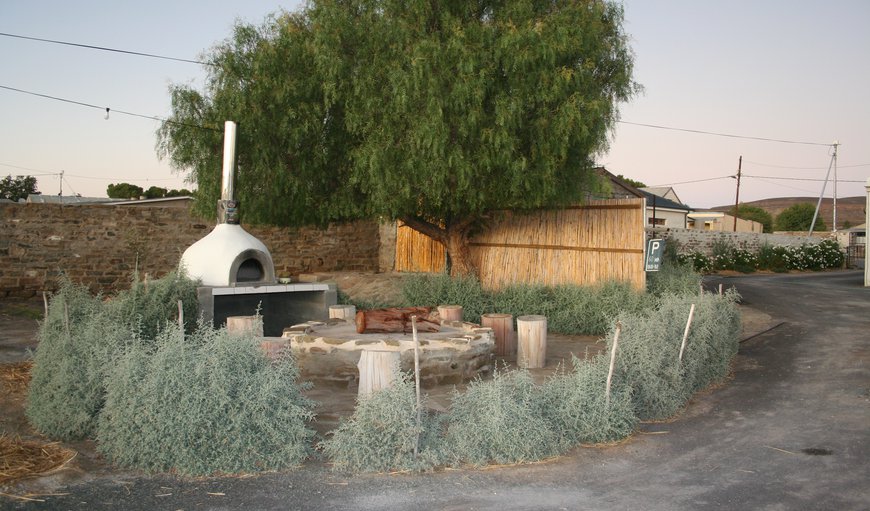 Fire boma and pizza oven in garden area in Sutherland, Northern Cape, South Africa