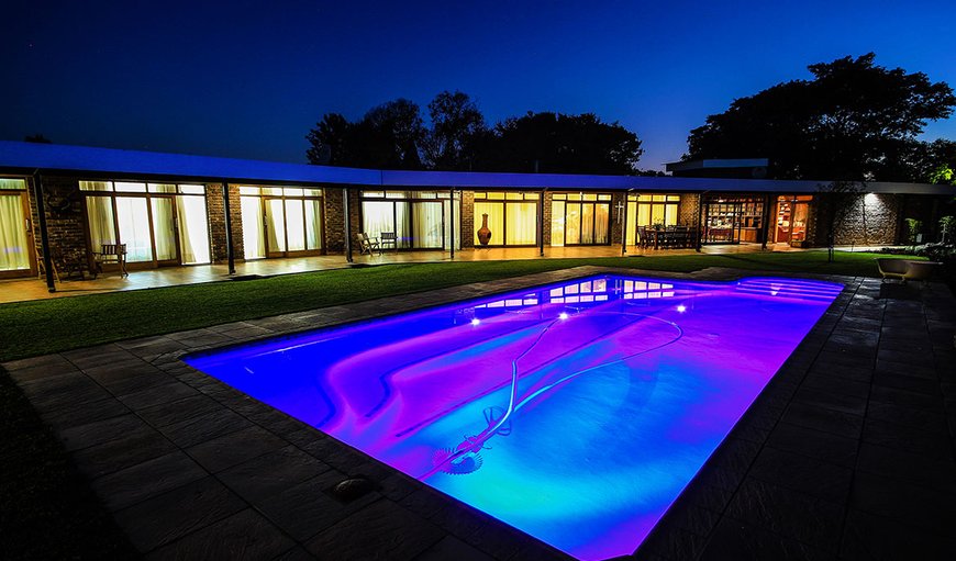 Exterior and pool at night