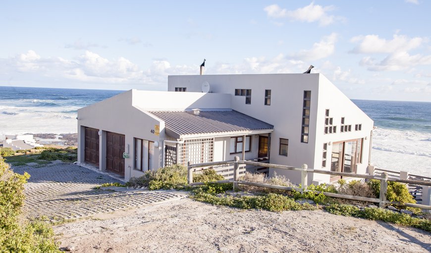 This double story house is situated one row of houses from the sea and offers parking for at least four cars. This double story house is situated one row of houses from the sea and offers parking for at least four cars.