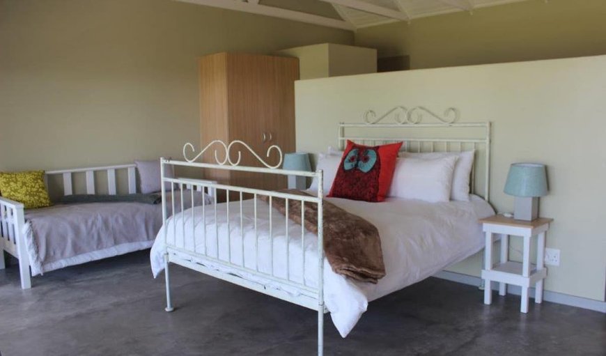 Queen Room: Unit 7 bedroom with double bed, air-con, en-suite bathroom and selected DSTV channels.