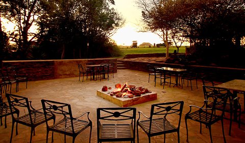 Paperbark Room: Paperbark Lodge with chairs by the fire pit.