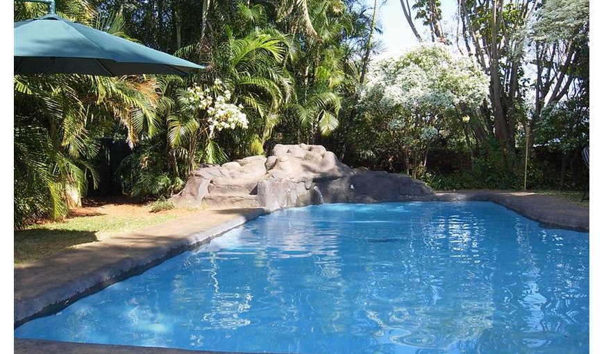 Lovely swimming pool area with a lapa, Jacuzzi and braai area.