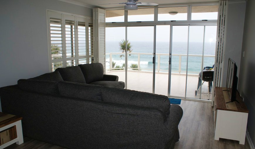 3 Bedroom Apartment: Lounge leading out onto patio with seaviews.