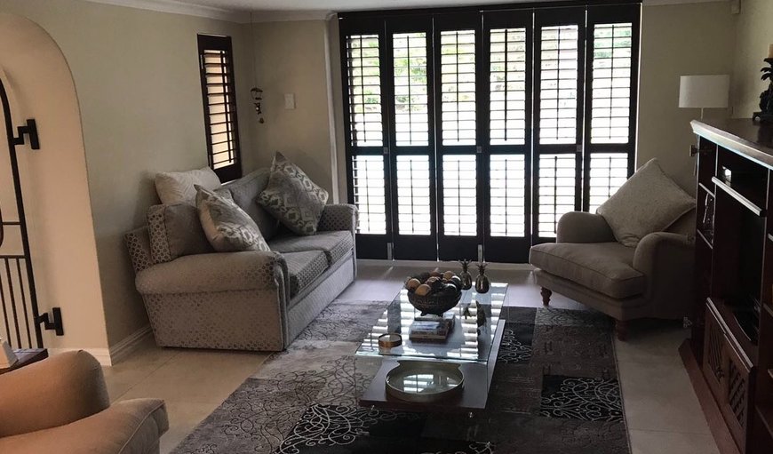 Alphen Cottage: Inviting lounge area with a TV.