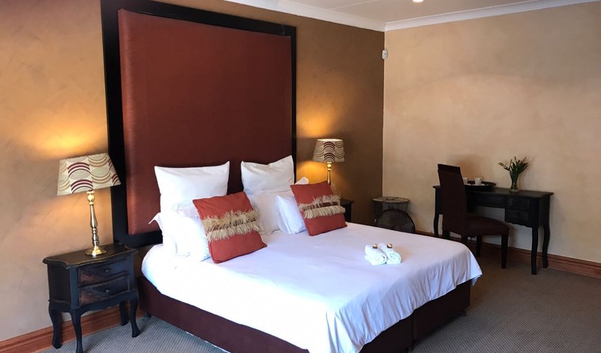 Standard Luxury Room: Standard Luxury Room - Each en-suite bedroom is tastefully furnished with a queen size bed, a TV with DSTV, a hairdryer, bar fridge and a kettle with complimentary coffee and tea.