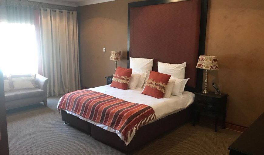 Standard Luxury Room: Standard Luxury Room - Each en-suite bedroom is tastefully furnished with a queen size bed, a TV with DSTV, a hairdryer, bar fridge and a kettle with complimentary coffee and tea.