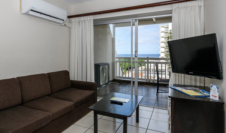 Two Bedroom Apartment with Balcony: Lounge with TV (Selected DSTV channels)