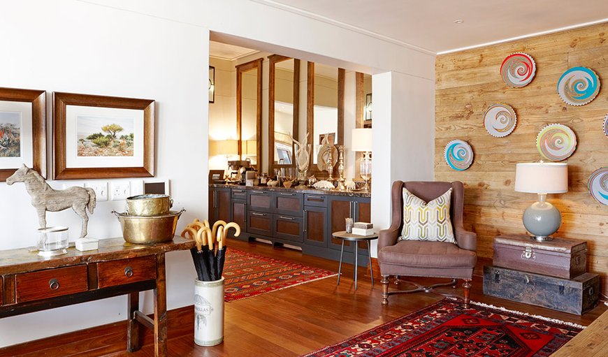 The entrance hall way to the dining area and lounge is beautifully finished with hand crafted ornaments and comfortable seating The entrance hall way to the dining area and lounge is beautifully finished with hand crafted ornaments and comfortable seating
