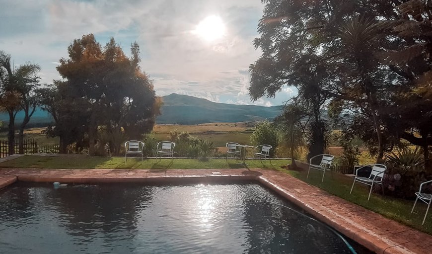 View of pool and beautiful garden, mountains and valley. in Graskop, Mpumalanga, South Africa