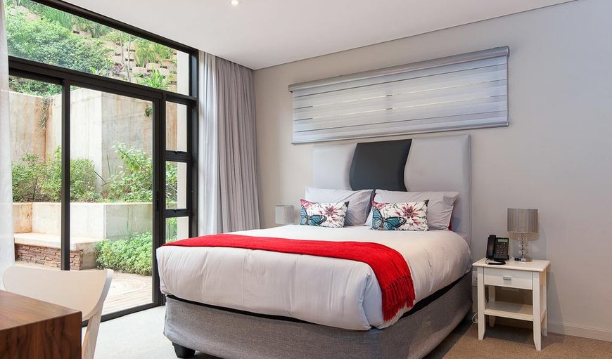 Zimbali Suites 224: Bedroom with sliding doors leading to the patio