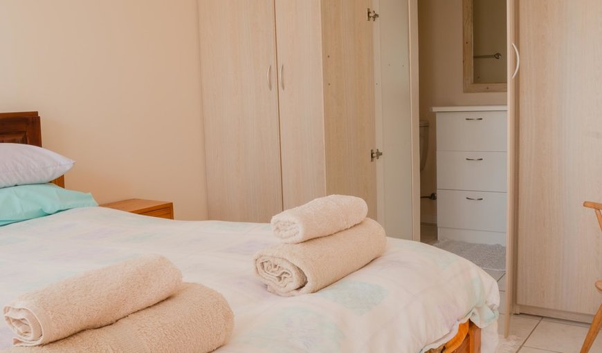 Lagoonside (9): This bedroom is furnished with a double bed and an en-suite bathroom.