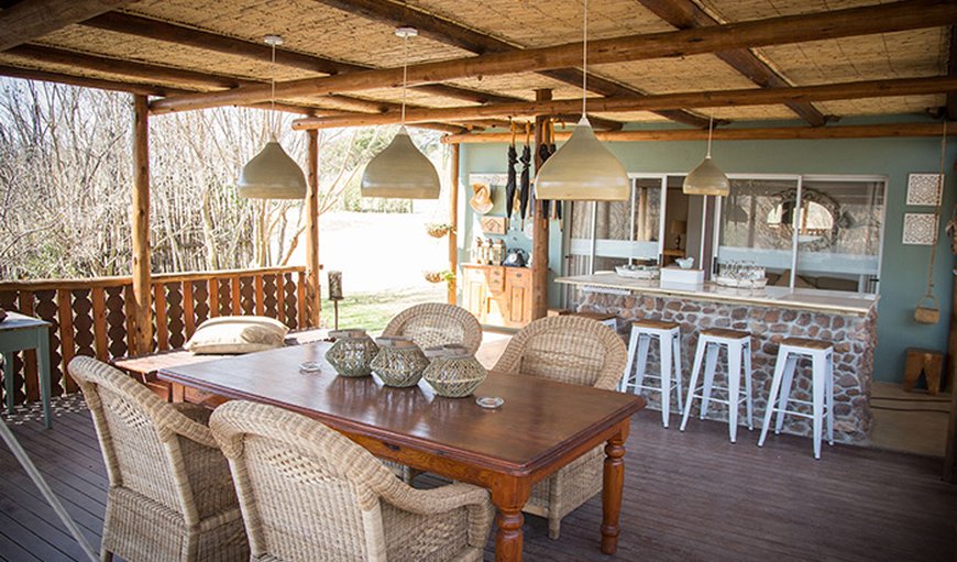 Patio with dining table and kitchen