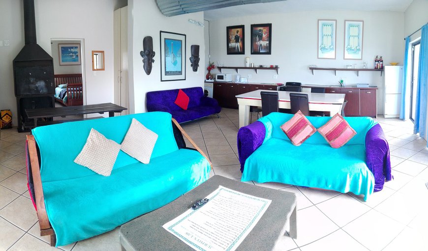 The open plan lounge area has an indoor braai area and a TV with hotel package DSTV.